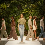 Models on a runway wearing sustainable fashion, organic fabrics